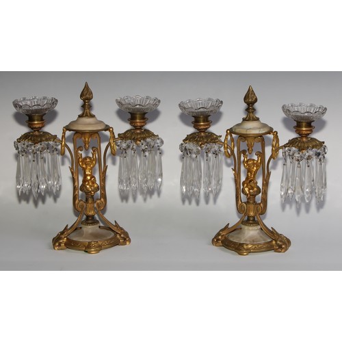 1815 - A pair of 19th century French gilt metal and alabaster two-light mantel candle lustres, each centred... 