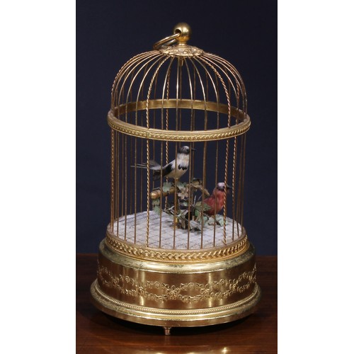 1827 - A Swiss gilt metal musical bird cage automaton, by Reuge Music, Sainte-Croix, with two singing birds... 