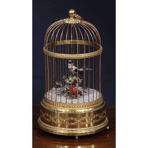 1827 - A Swiss gilt metal musical bird cage automaton, by Reuge Music, Sainte-Croix, with two singing birds... 