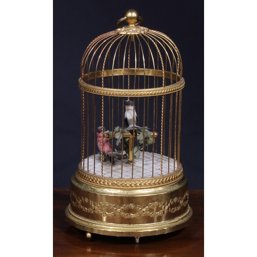 1827 - A Swiss gilt metal musical bird cage automaton, by Reuge Music, Sainte-Croix, with two singing birds... 