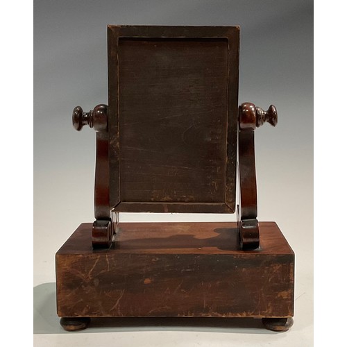 1930 - An unusually small Victorian mahogany dressing glass, rectangular tilting mirror plate flanked by sc... 