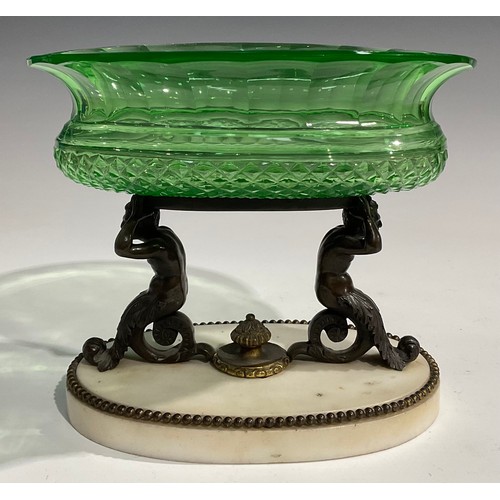 1560 - A 19th century dark patinated bronze, carara marble and green glass table centrepiece, the oval hobn... 