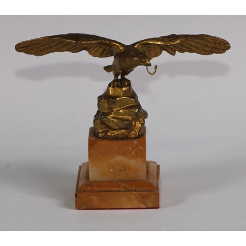 1669 - A 19th century gilt bronze and sienna marble pocket watch stand, cast as an eagle perched on a rocky... 