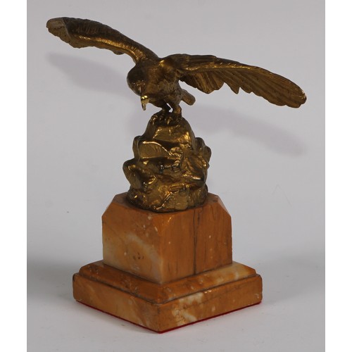 1669 - A 19th century gilt bronze and sienna marble pocket watch stand, cast as an eagle perched on a rocky... 