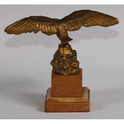 1669 - A 19th century gilt bronze and sienna marble pocket watch stand, cast as an eagle perched on a rocky... 