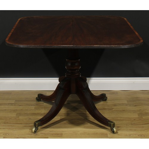 2370 - A Regency tulipwood crossbanded mahogany centre table, rounded rectangular tilting top, turned colum... 