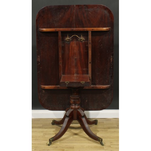 2370 - A Regency tulipwood crossbanded mahogany centre table, rounded rectangular tilting top, turned colum... 