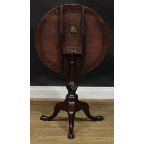 1936 - A George III mahogany tripod occasional table, circular tilting top, turned and wrythen-fluted colum... 