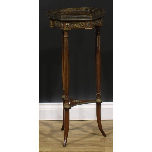 1967 - A Louis XVI Revival gilt metal mounted mahogany urn stand, hexagonal top with pierced gallery, flute... 