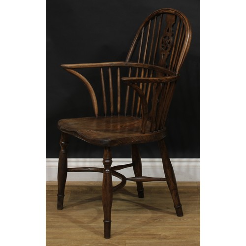 1722 - A country house beech, ash and elm star-back Windsor elbow chair, hoop back, shaped and pierced spla... 