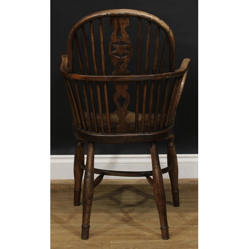 1722 - A country house beech, ash and elm star-back Windsor elbow chair, hoop back, shaped and pierced spla... 