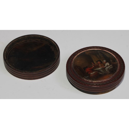 2169 - A 19th century tortoiseshell circular snuff box, the push-fitting cover reverse painted with figures... 