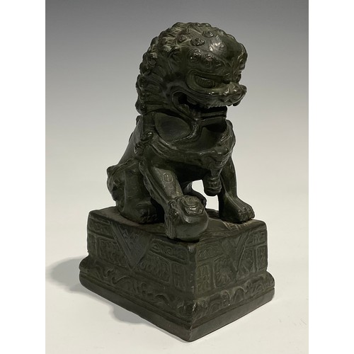 462 - Chinese School, a verdigris patinated bronze, of a temple guardian lion, rectangular base, 18.5cm hi... 