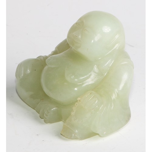 382 - A Chinese jade carving, of Budai, he sits, rotund, holding beads, 10cm wide, hardwood stand; a pair ... 