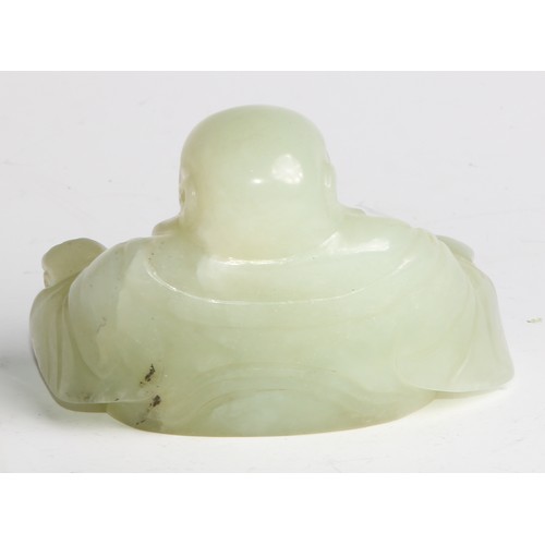 382 - A Chinese jade carving, of Budai, he sits, rotund, holding beads, 10cm wide, hardwood stand; a pair ... 