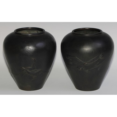 427 - A pair of Japanese dark patinated bronze ovoid vases, cast with carp and geese, 21cm high, signed, M... 