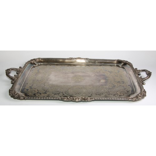 816 - A large Victorian E.P.N.S rounded rectangular two-handled serving tray, gadrooned shell and leafy-sc... 