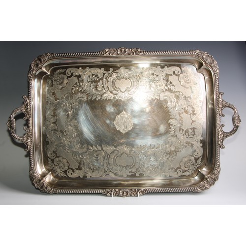 816 - A large Victorian E.P.N.S rounded rectangular two-handled serving tray, gadrooned shell and leafy-sc... 