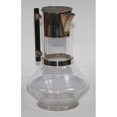 833 - A Victorian E.P.N.S mounted claret jug, designed by Dr Christopher Dresser (1834 - 1904), hinged cov... 