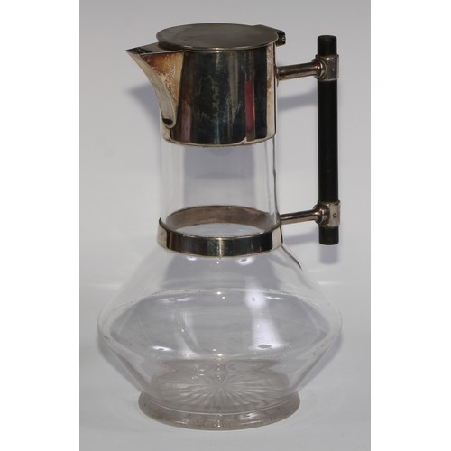 833 - A Victorian E.P.N.S mounted claret jug, designed by Dr Christopher Dresser (1834 - 1904), hinged cov... 