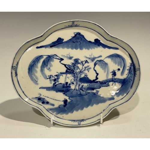 403 - A Chinese quatrefoil lobed shallow dish or tray, of silver shape, painted in tones of underglaze blu... 