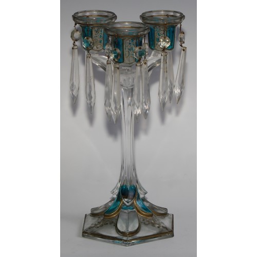 322 - A pair of 19th century pressed glass three-light candle lustres, with blue-flash panels picked out w... 