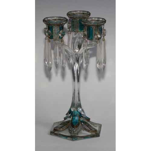 322 - A pair of 19th century pressed glass three-light candle lustres, with blue-flash panels picked out w... 