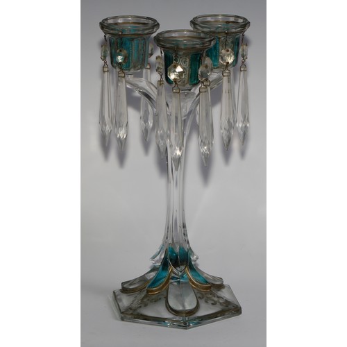 322 - A pair of 19th century pressed glass three-light candle lustres, with blue-flash panels picked out w... 