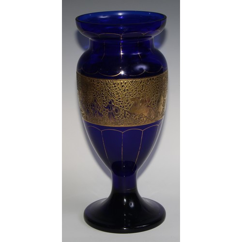 318 - A Moser blue and gilt glass pedestal, decorated with a broad frieze of Classical figures, 40.5cm hig... 