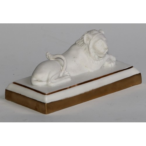 289 - A Dagoty porcelain model, of a recumbent lion, in the white with gilt borders, 11cm wide, red mark, ... 