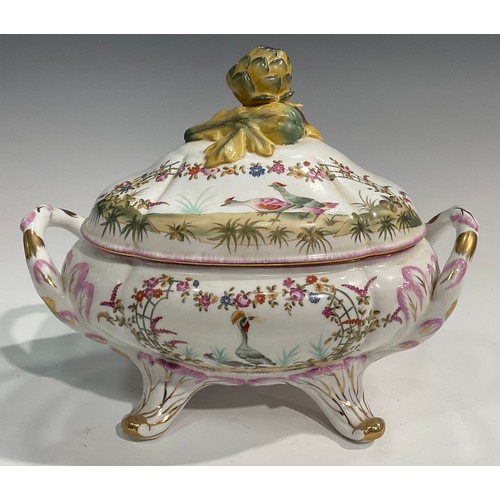 303 - A pair of porcelain fluted oval tureens and covers decorated in polychrome with birds and flowers, p... 