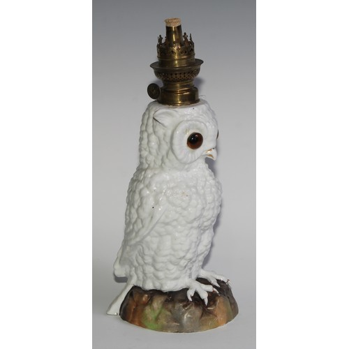 287 - A Continental porcelain novelty oil lamp, as an owl, 33cm high overall, c.1900