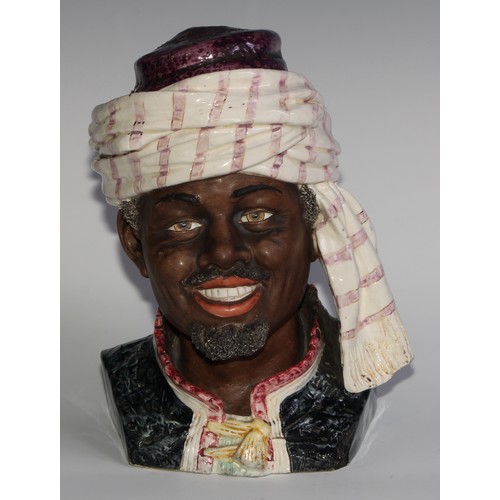 312 - An Austrian pottery novelty tobacco jar, modelled as the head of a Moor, 28cm high, impressed number... 