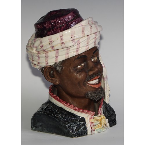 312 - An Austrian pottery novelty tobacco jar, modelled as the head of a Moor, 28cm high, impressed number... 