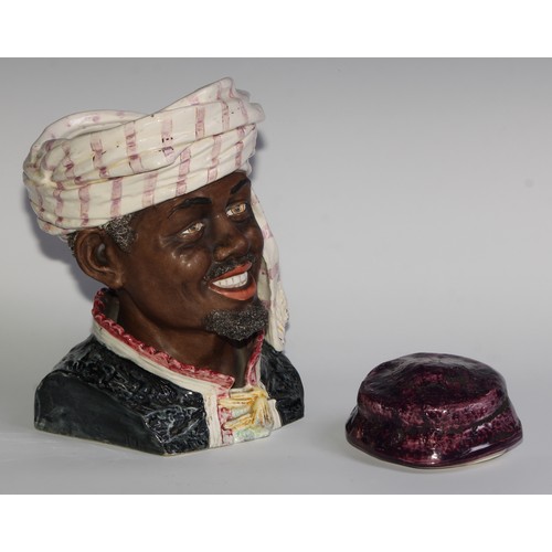 312 - An Austrian pottery novelty tobacco jar, modelled as the head of a Moor, 28cm high, impressed number... 