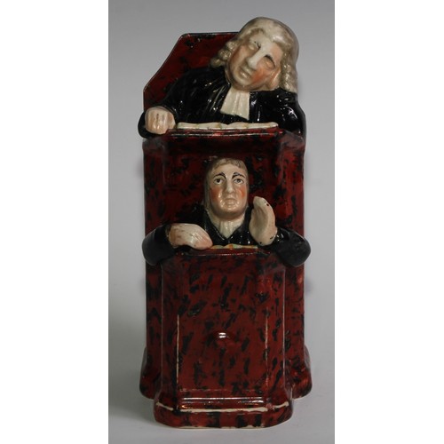 100 - A Staffordshire Vicar and Moses group, typically modelled and coloured in polychrome, 26cm high, c.1... 