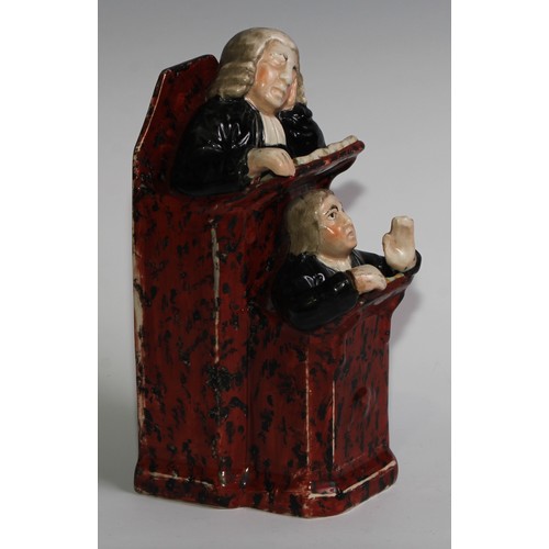 100 - A Staffordshire Vicar and Moses group, typically modelled and coloured in polychrome, 26cm high, c.1... 