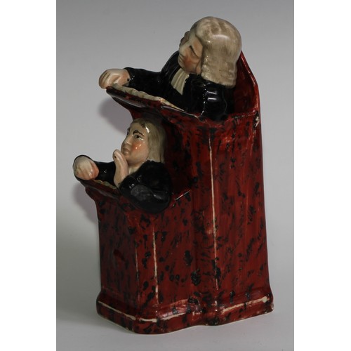 100 - A Staffordshire Vicar and Moses group, typically modelled and coloured in polychrome, 26cm high, c.1... 