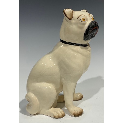 96 - A pair of 19th century Staffordshire models of pugs, seated to left and right, painted features, 28c... 