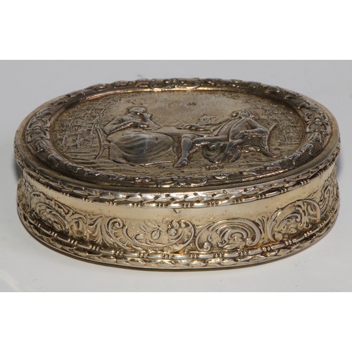 1144 - An early 20th century Dutch silver-gilt oval table snuff box, chased with topers and their wives, th... 