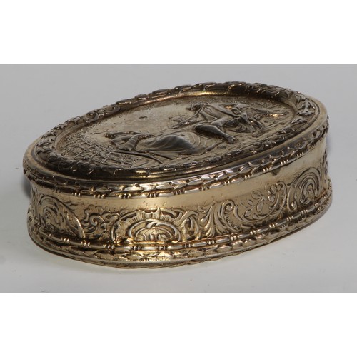 1144 - An early 20th century Dutch silver-gilt oval table snuff box, chased with topers and their wives, th... 