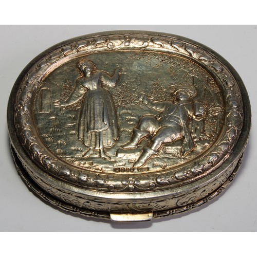 1144 - An early 20th century Dutch silver-gilt oval table snuff box, chased with topers and their wives, th... 