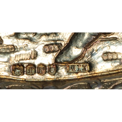 1144 - An early 20th century Dutch silver-gilt oval table snuff box, chased with topers and their wives, th... 