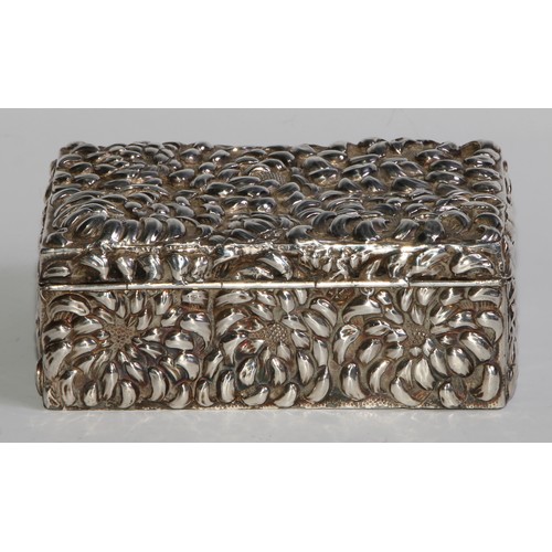 986 - A Japanese silver rectangular box, chased overall with chrysanthemums, hardwood lined, 13cm wide, Me... 