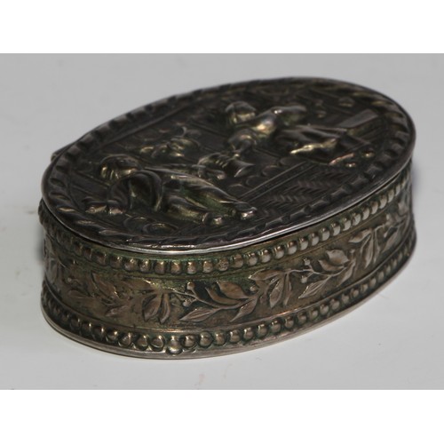 984 - A German silver oval snuff box, hinged cover embossed with a couple revelling, 4.5cm wide, halbmond ... 