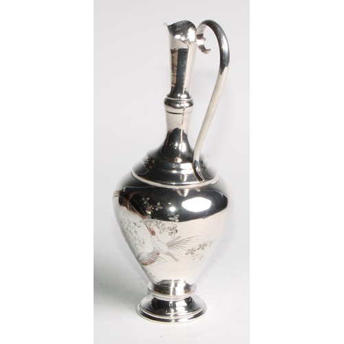 1048 - A Russian silver ewer, engraved in the Aesthetic Movement taste with birds and flowering branches, l... 