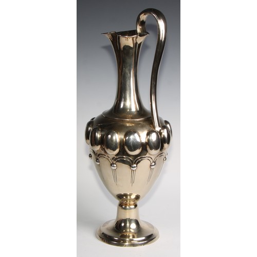 998 - A large Victorian silver-gilt pedestal ewer, in the Renaissance Revival taste, chased with a band of... 