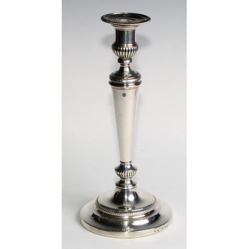 1223 - Matthew Boulton - a pair of George III silver table candlesticks, half-fluted campana sconces with d... 