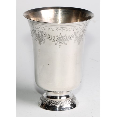 887 - A French silver bell shaped pedestal beaker, wrigglework engraved with leafy swags and pendants, dom... 