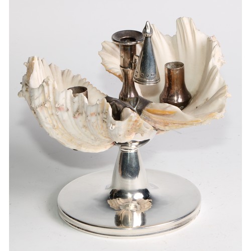 1193 - An unusual George III silver conchological chamberstick, incorporating a pair of exotic sea shells, ... 